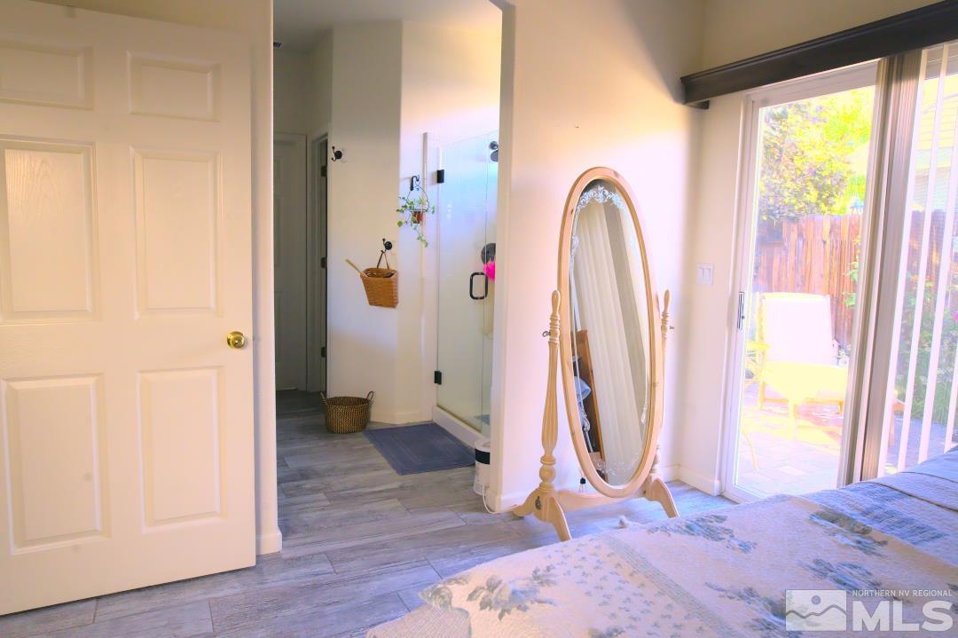 9612 Truckee Meadows Place Reno, NV 89521 - Photo 10 of 29 a view of a bedroom with wooden floor and windows
