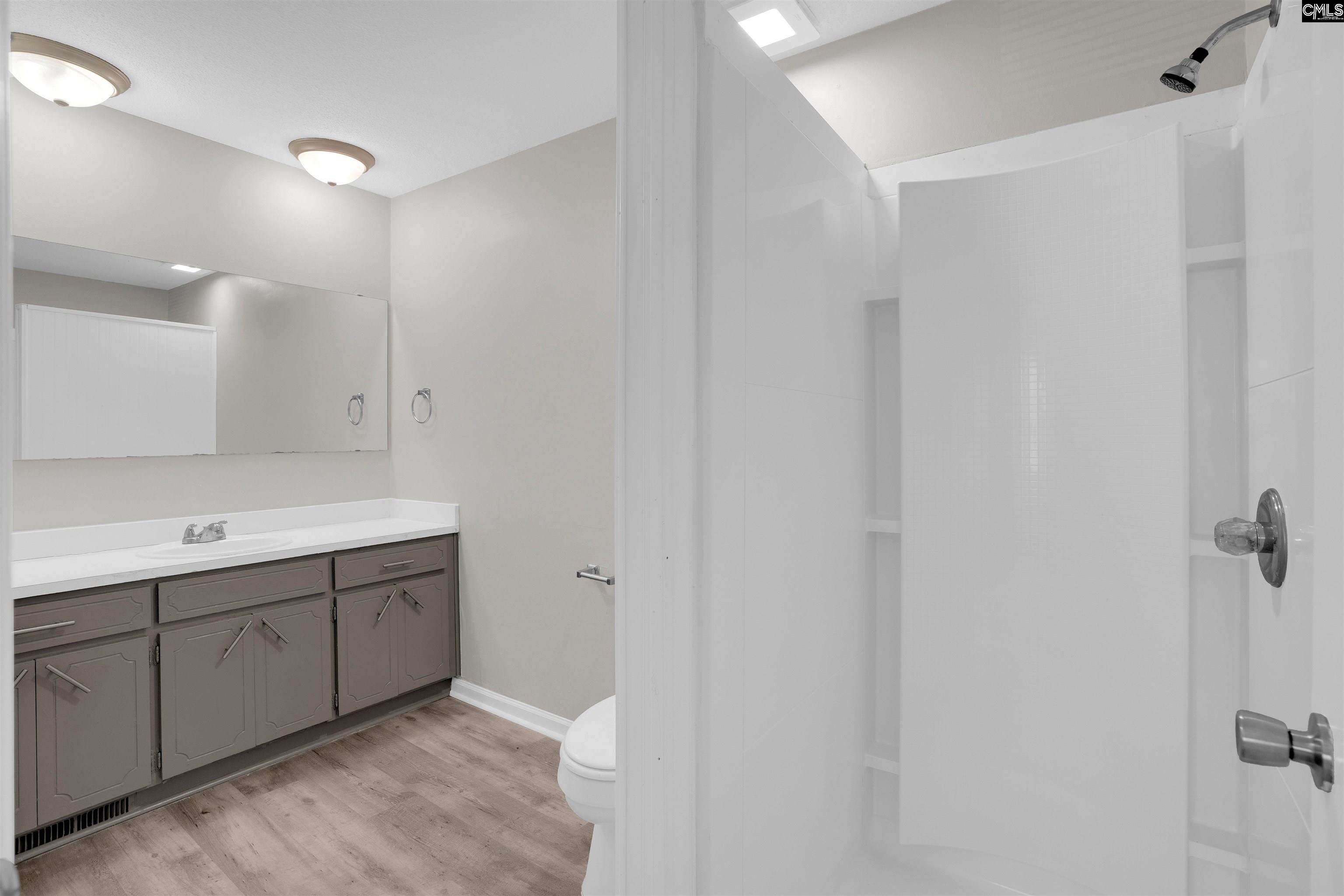 2620 Pleasant Ridge Drive Columbia, SC 29209 - Photo 30 of 37 a bathroom with a double vanity sink and mirror