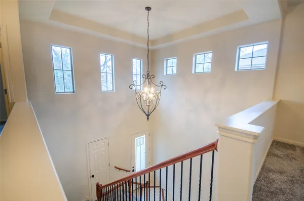 a view of a hallway with windows