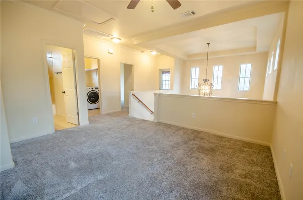 a view of an empty room with a fireplace