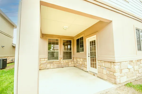 a front view of a house with a large window