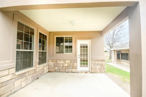 front view of a house with a large window