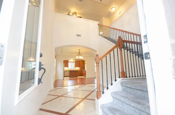 a view of entryway and hall with a front door