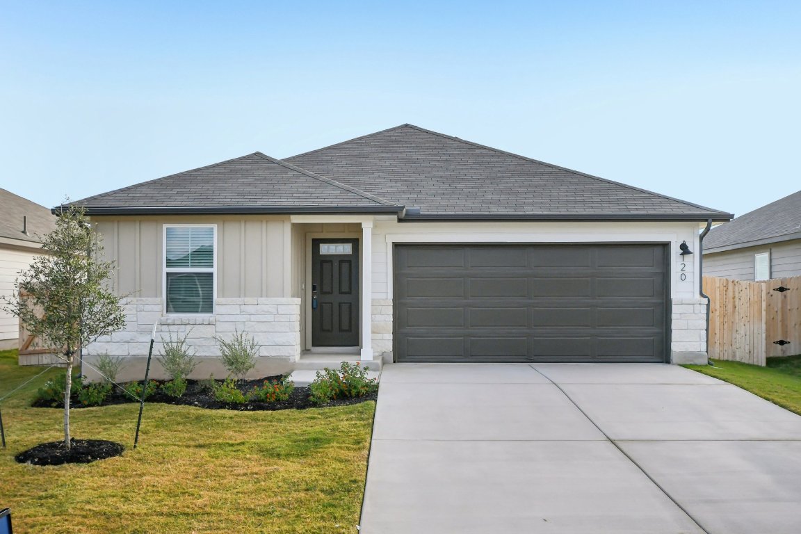 120 Honey Bee Road Jarrell, TX 76537 - Photo 1 of 1 a front view of house with yard garage and garage