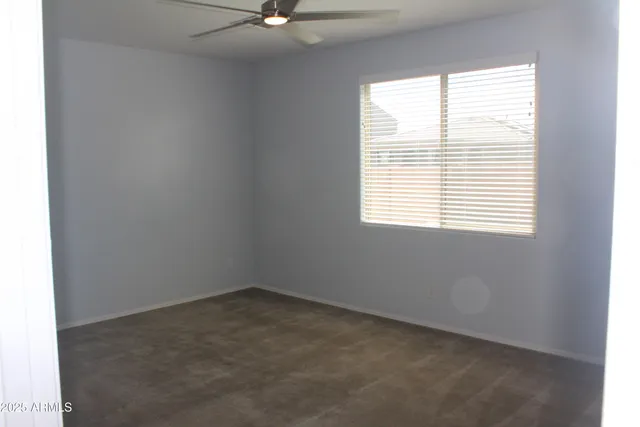 a bathroom with a granite countertop sink shower and a mirror