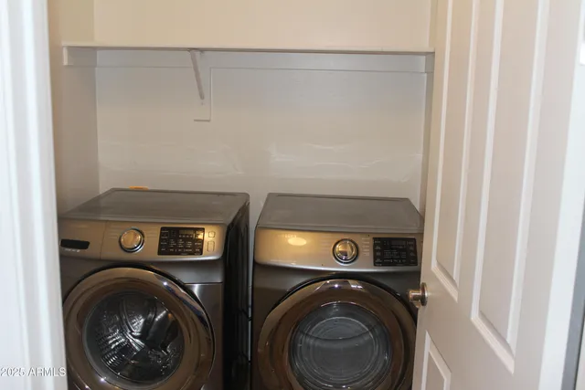 a view of a livingroom with wooden floor and a flat screen tv
