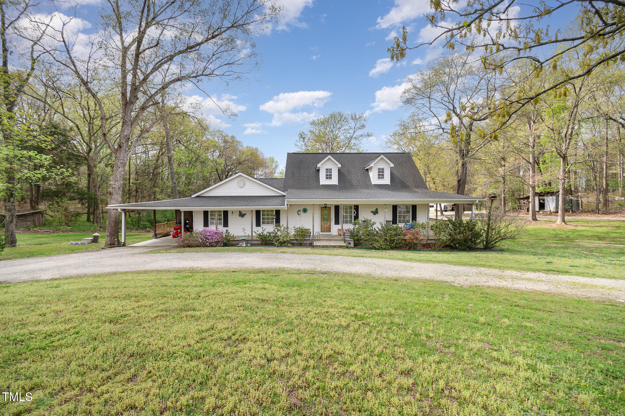 472 Jesse Phillips Road Robbins, NC 27325 - Photo 1 of 36 a front view of a house with garden
