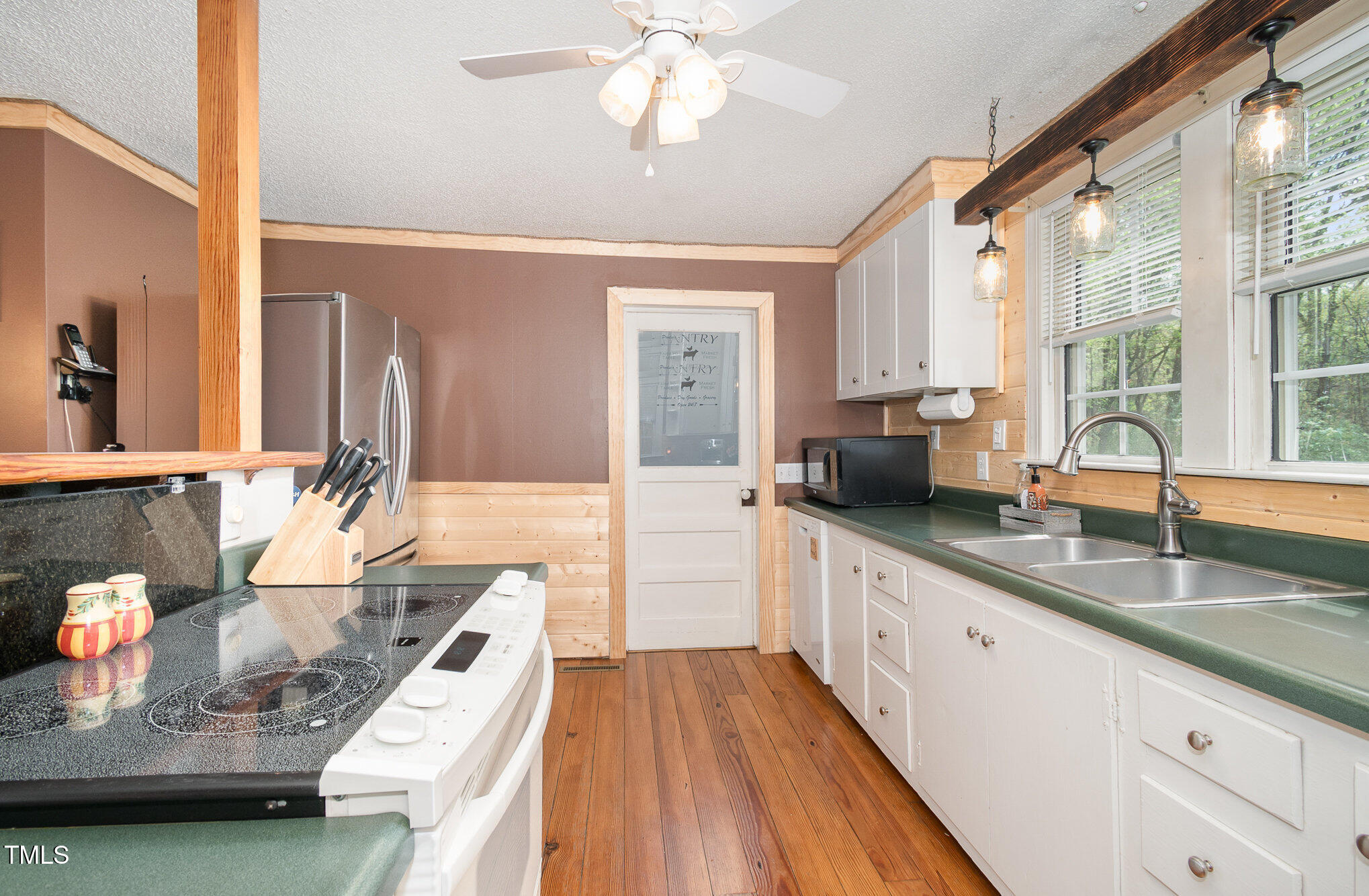 472 Jesse Phillips Road Robbins, NC 27325 - Photo 12 of 36 a large kitchen with granite countertop a large window and a sink