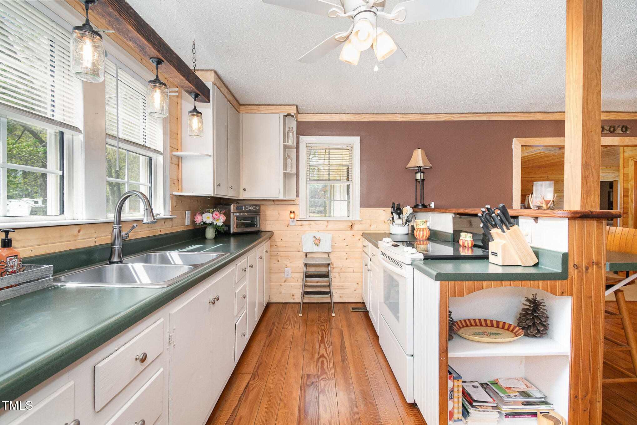 472 Jesse Phillips Road Robbins, NC 27325 - Photo 13 of 36 a large kitchen with kitchen island granite countertop lots of counter top space and a sink