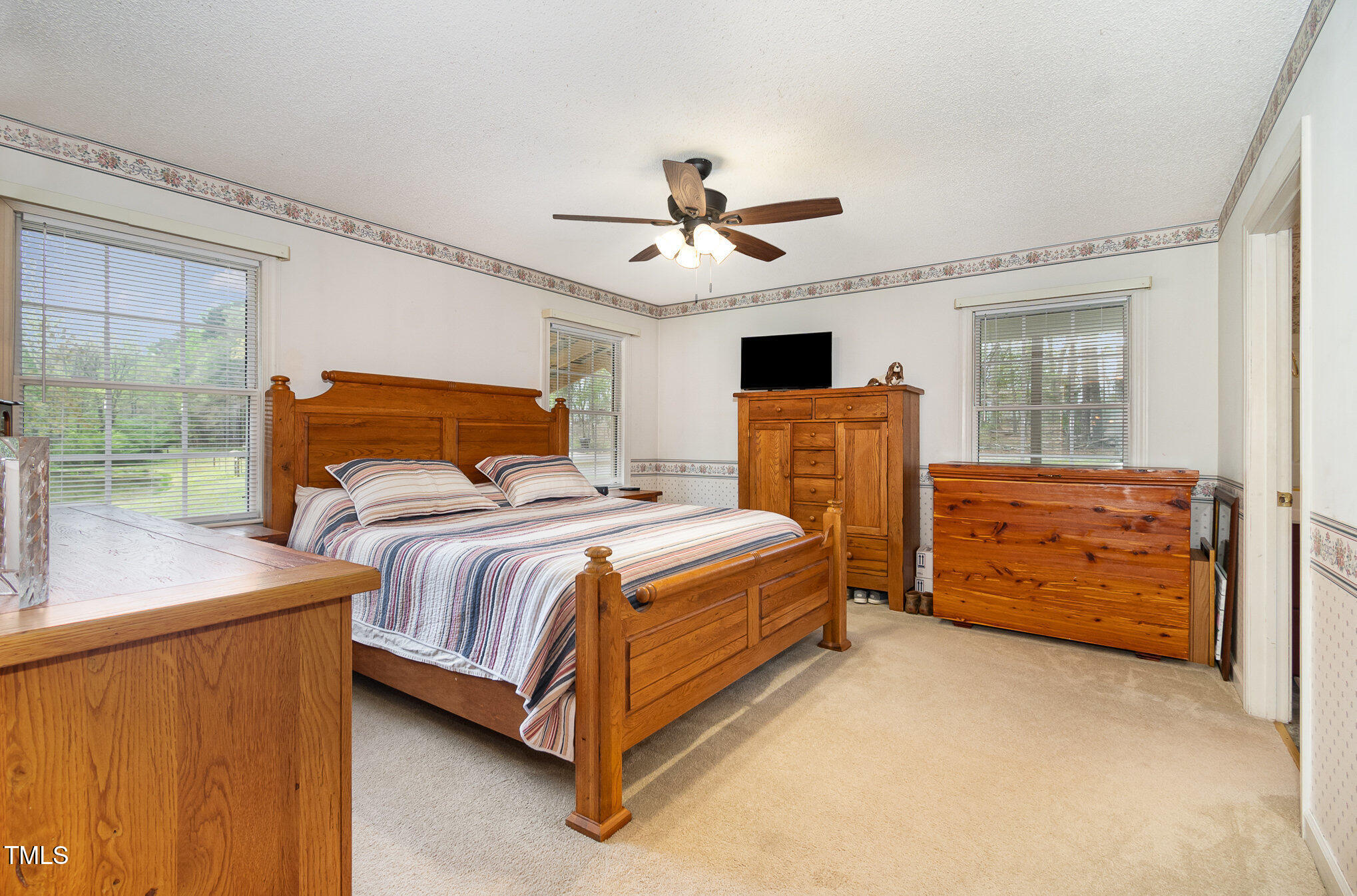 472 Jesse Phillips Road Robbins, NC 27325 - Photo 18 of 36 a bedroom with a bed dresser and a window