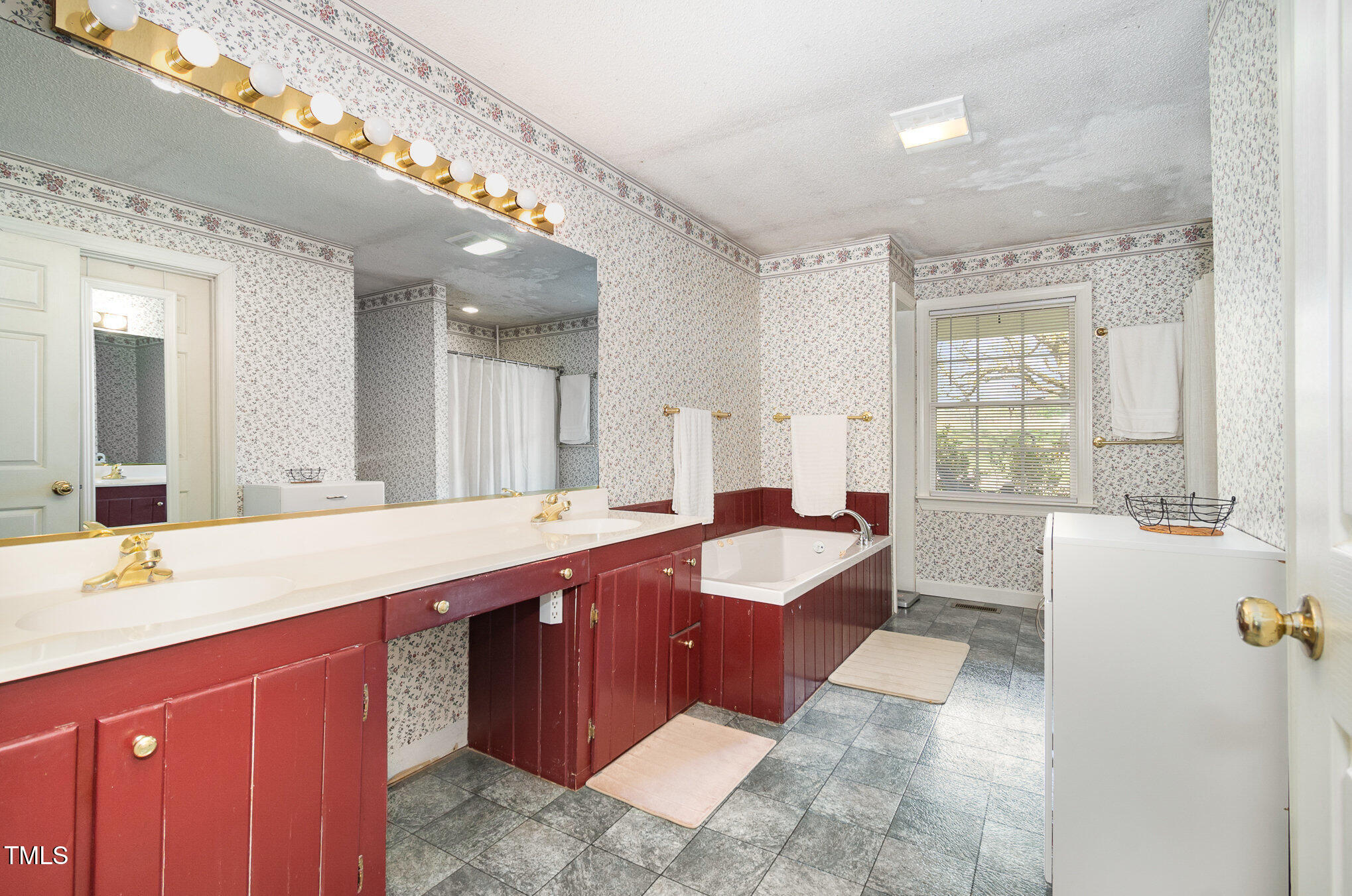 472 Jesse Phillips Road Robbins, NC 27325 - Photo 20 of 36 a spacious bathroom with a granite countertop tub sink and mirror