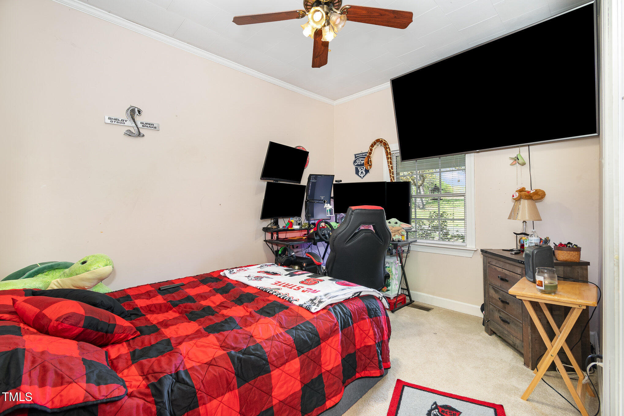 472 Jesse Phillips Road Robbins, NC 27325 - Photo 22 of 36 a bedroom with a bed and flat screen tv