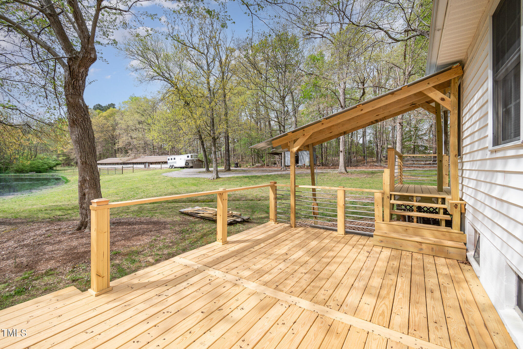 472 Jesse Phillips Road Robbins, NC 27325 - Photo 26 of 36 a view of a room with wooden floor and fence
