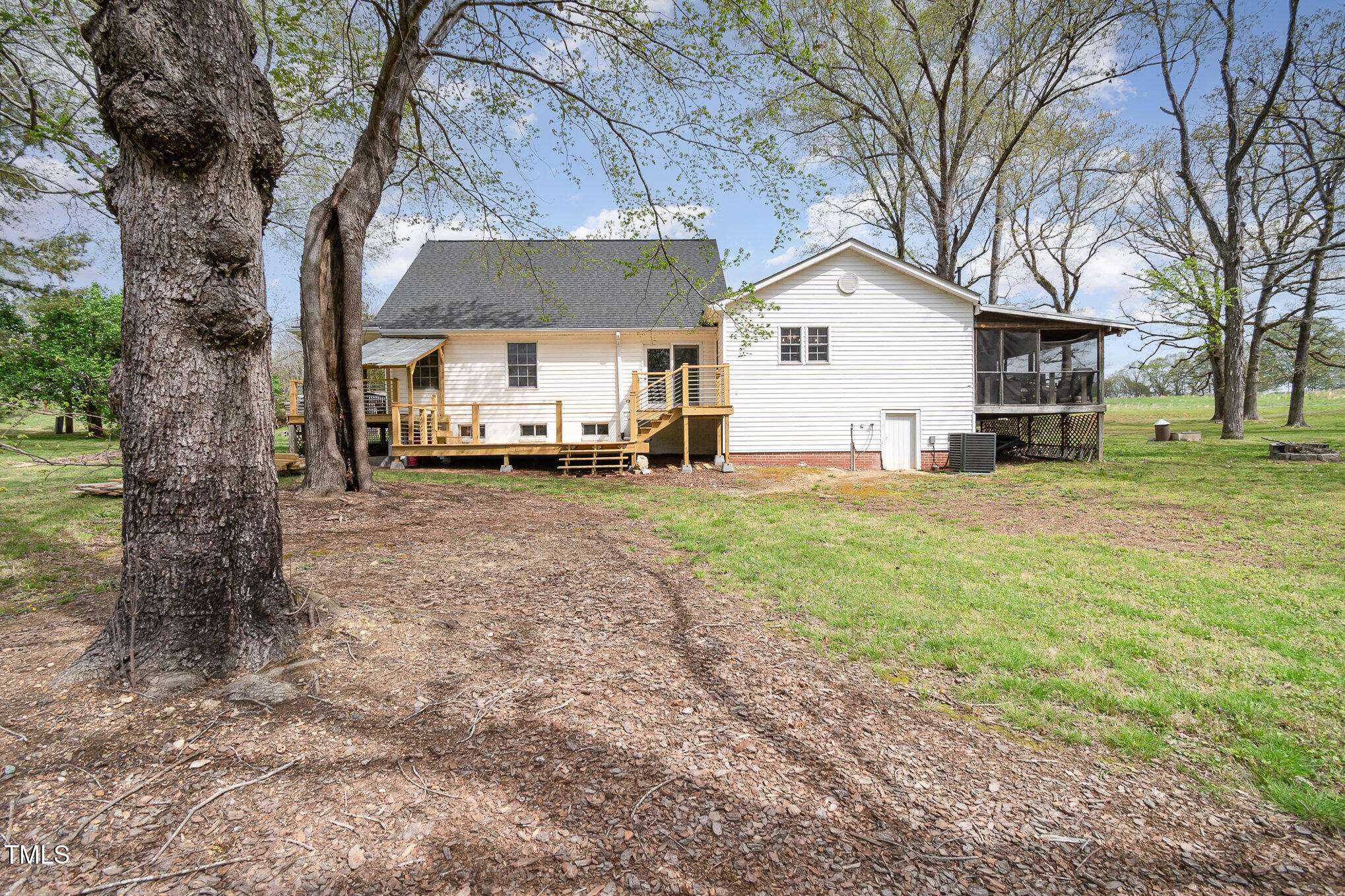 472 Jesse Phillips Road Robbins, NC 27325 - Photo 27 of 36 a view of a house with a yard and large trees