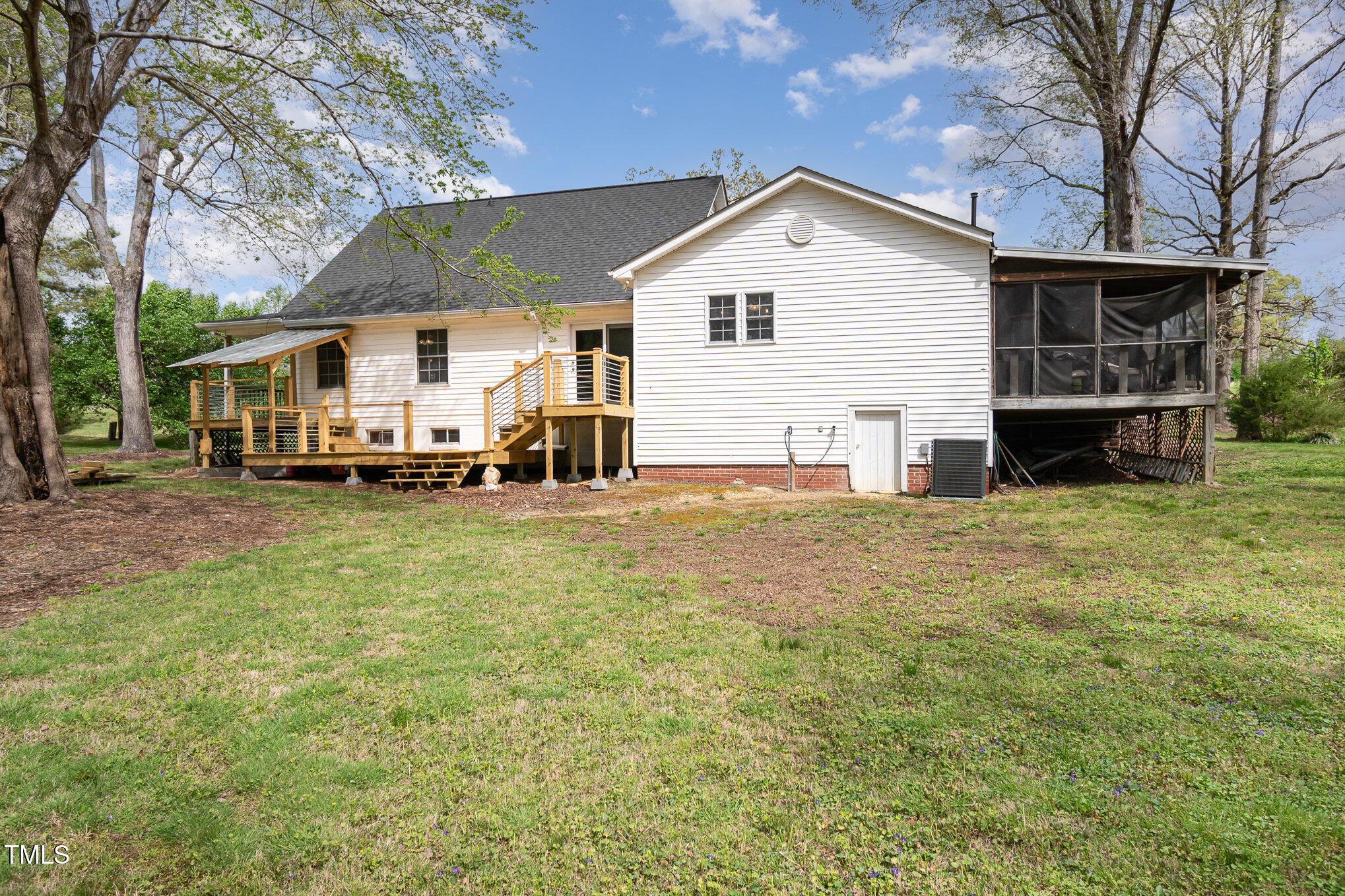 472 Jesse Phillips Road Robbins, NC 27325 - Photo 28 of 36 a front view of a house with a yard outdoor seating and garage