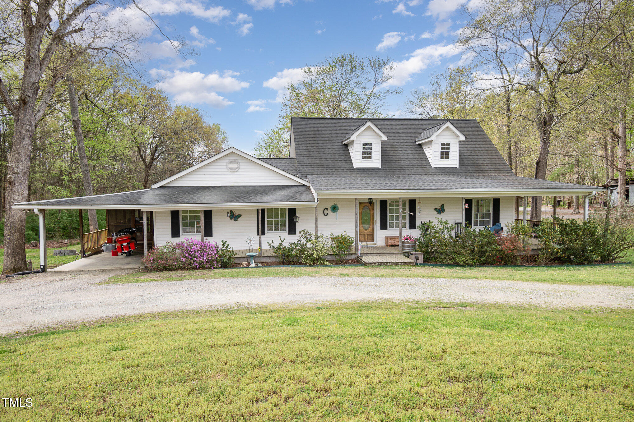 472 Jesse Phillips Road Robbins, NC 27325 - Photo 4 of 36 a front view of a house with garden and porch