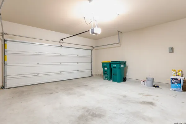 a room with a mirror and dresser