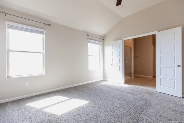 a view of an empty room with a window