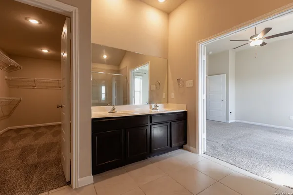 a bathroom with a sink and mirror