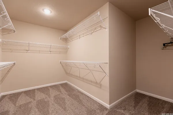 a view of storage and utility room with empty racks