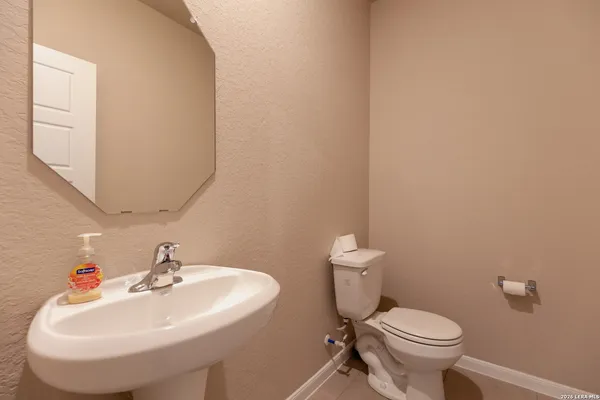 a bathroom with a sink and a toilet