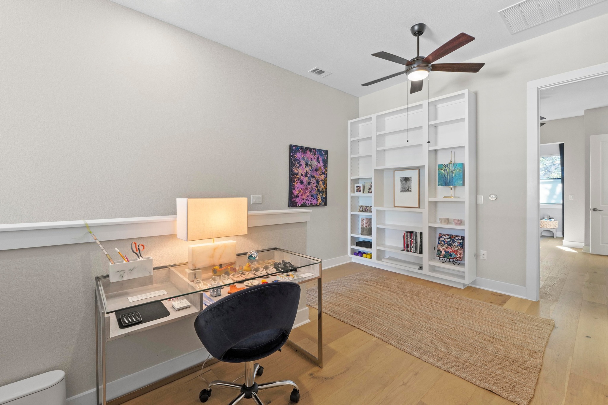 4323 Spicewood Springs Road, Unit 6 Austin, TX 78759 - Photo 21 of 40 Office space with light wood-type flooring, built in shelves, and ceiling fan