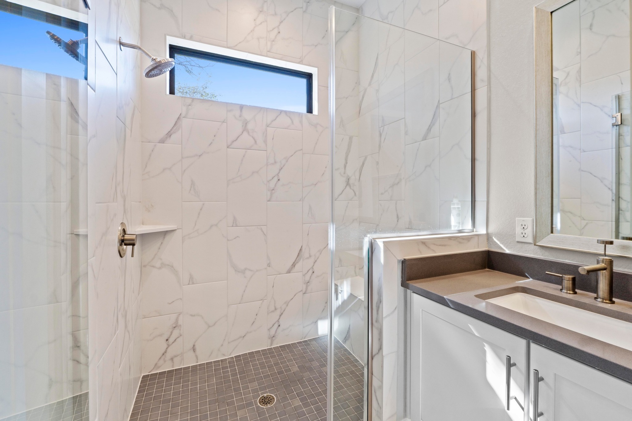 4323 Spicewood Springs Road, Unit 6 Austin, TX 78759 - Photo 29 of 40 Bathroom with vanity and a marble finish shower