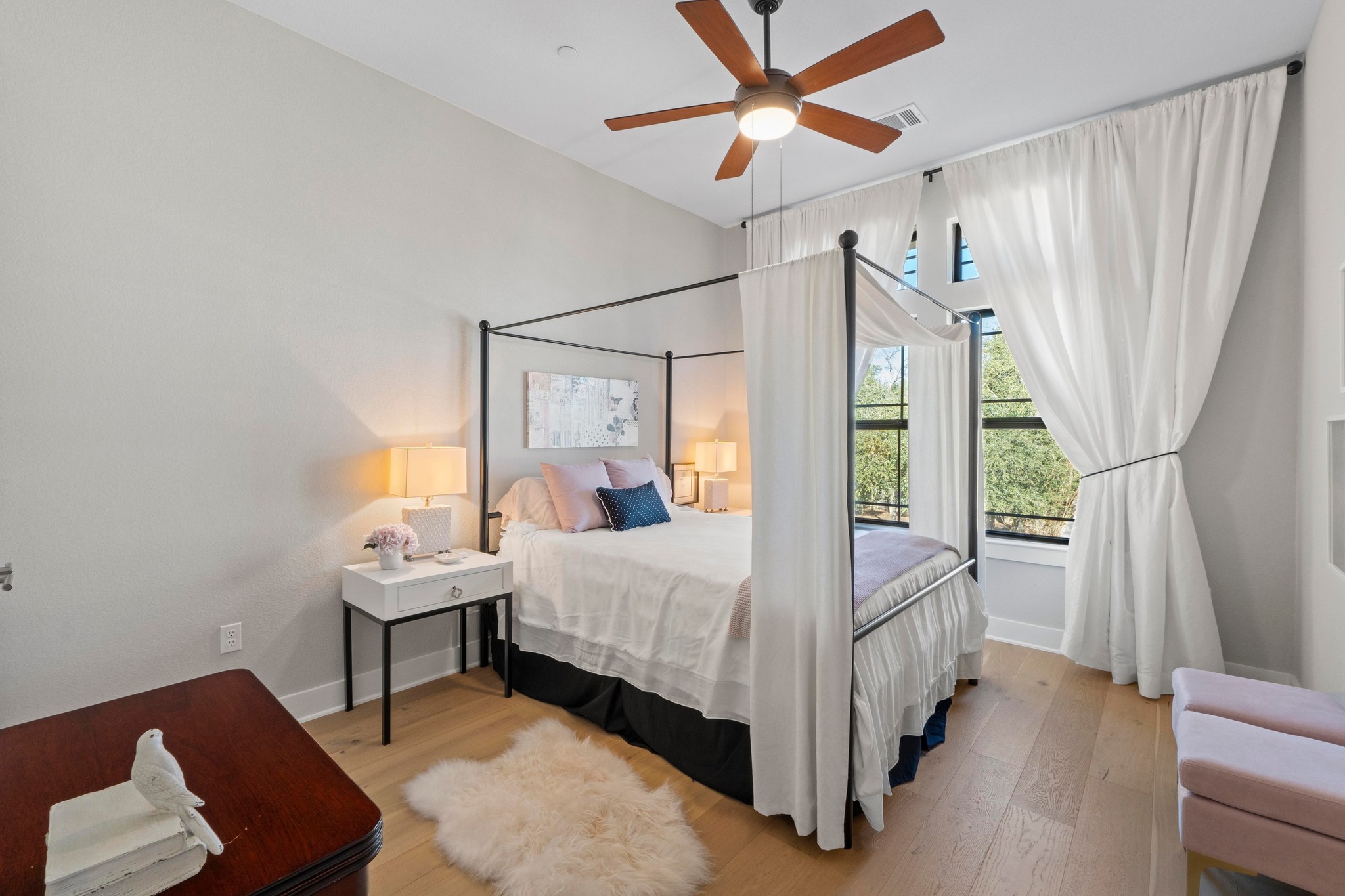 4323 Spicewood Springs Road, Unit 6 Austin, TX 78759 - Photo 31 of 40 Secondary Bedroom featuring light wood finished floors and ceiling fan