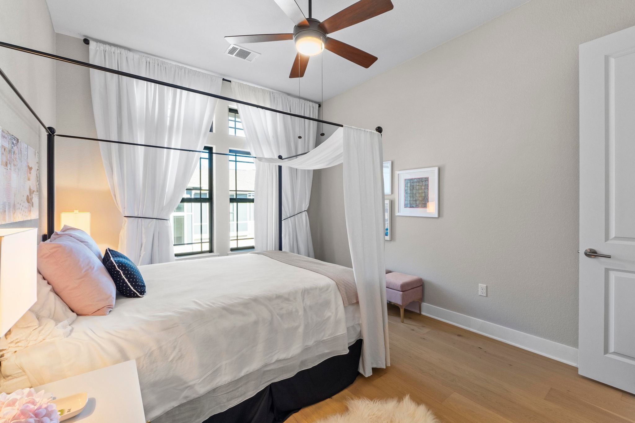 4323 Spicewood Springs Road, Unit 6 Austin, TX 78759 - Photo 32 of 40 Bedroom featuring light wood finished floors and a ceiling fan