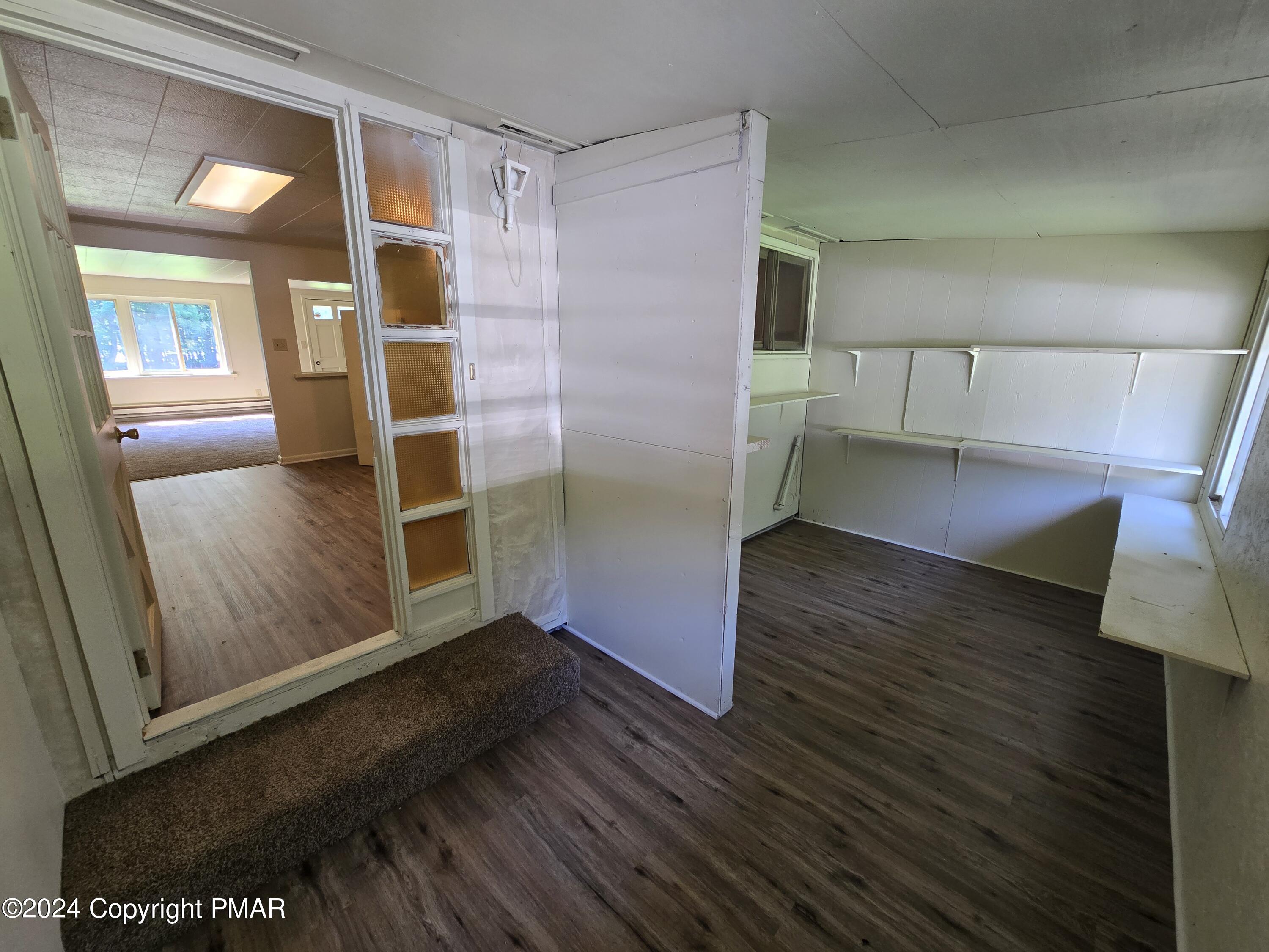 119 Maggie Way Effort, PA 18330 - Photo 2 of 7 a view of an empty room with wooden floor and a window