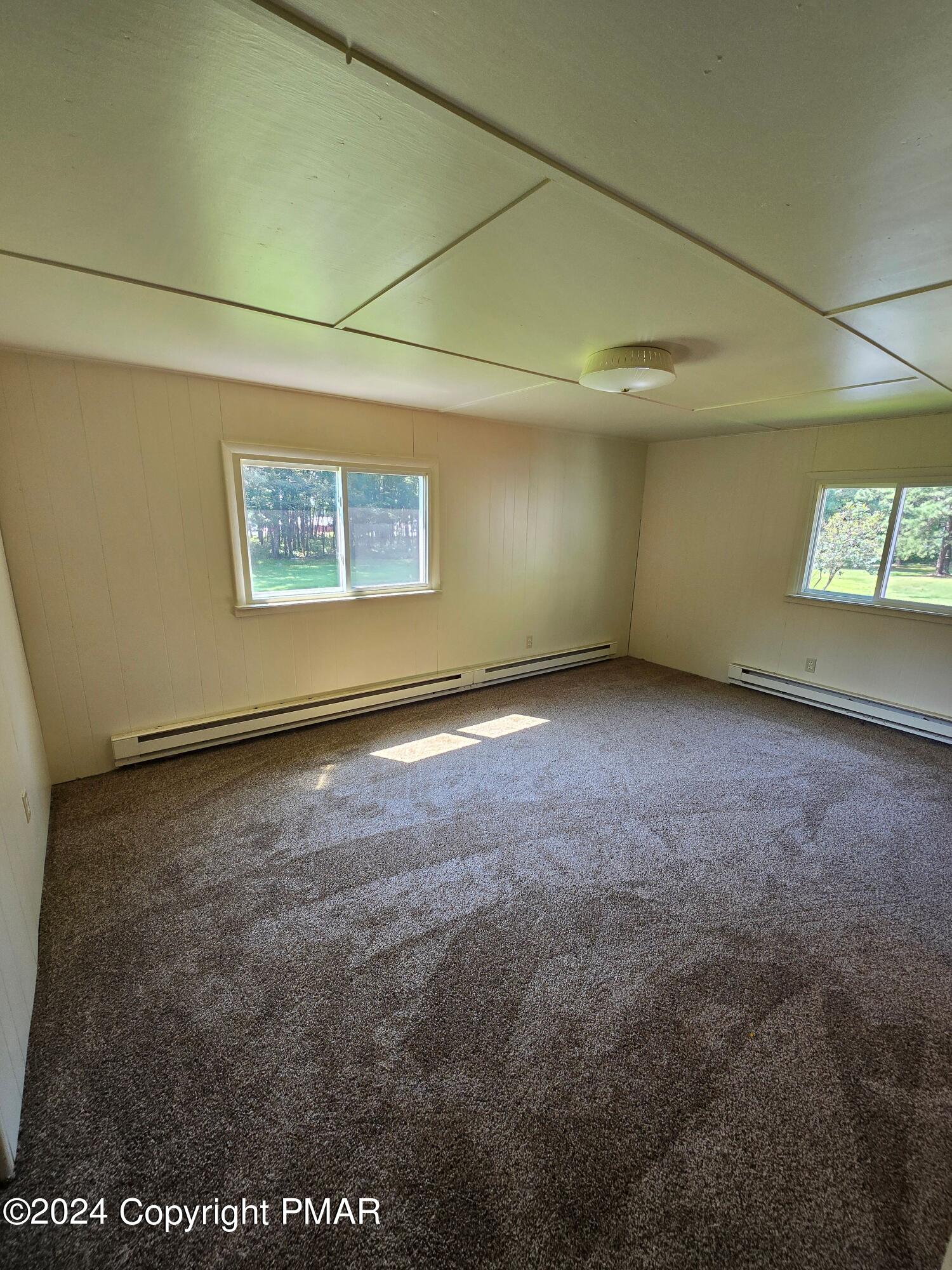 119 Maggie Way Effort, PA 18330 - Photo 5 of 7 a view of an empty room with windows