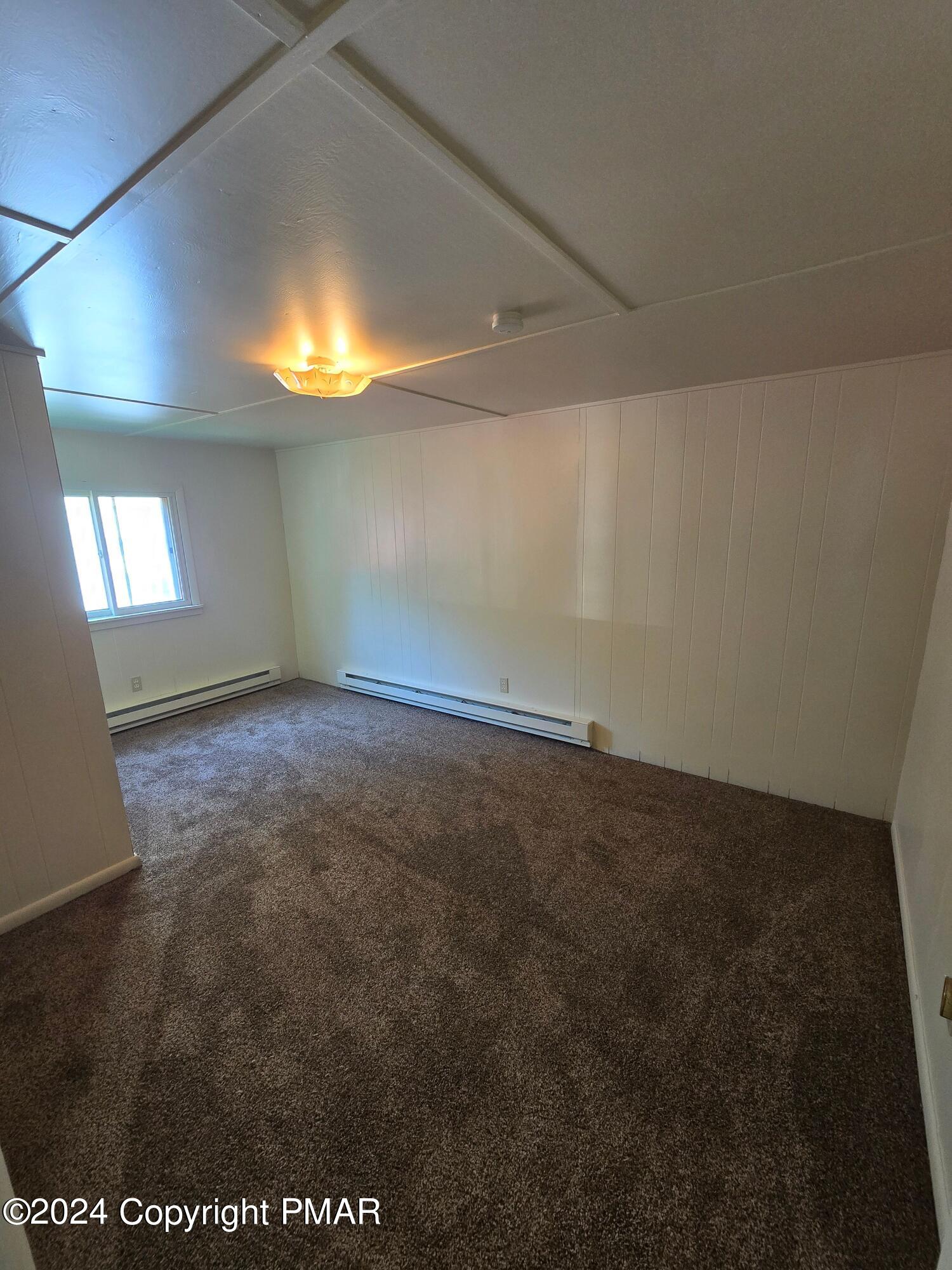 119 Maggie Way Effort, PA 18330 - Photo 7 of 7 an empty room with a empty space and windows
