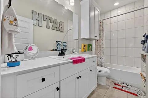 a bathroom with a bath tub sink and toilet