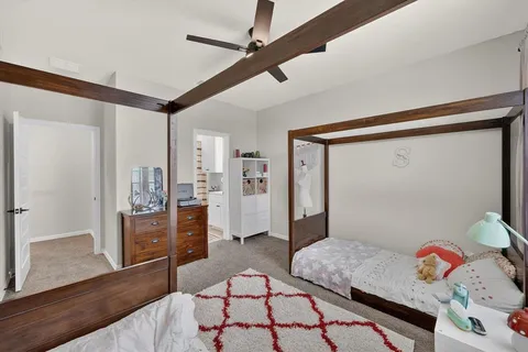a bedroom with furniture and a window