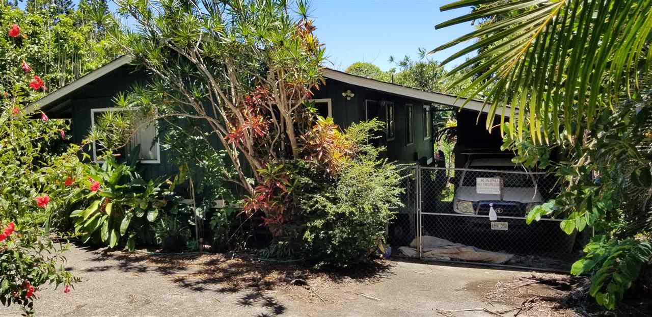 564 West Kuiaha Road Haiku, HI 96708 - Photo 1 of 6 a front view of a house with garden