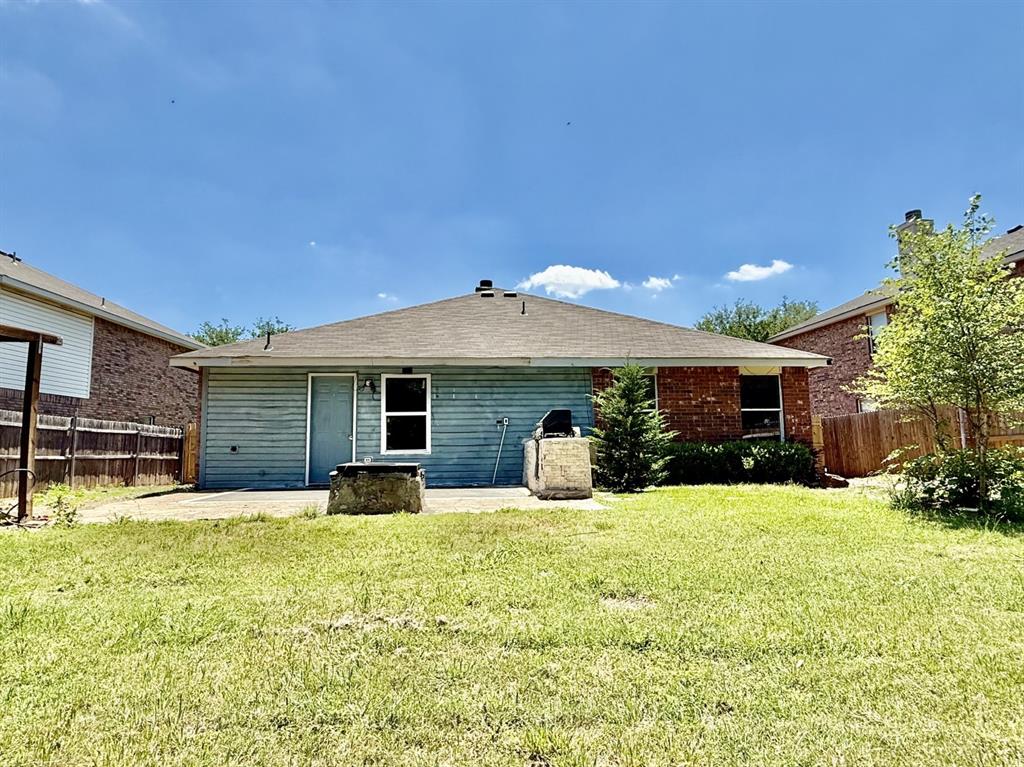 1144 Switchgrass Lane Crowley, TX 76036 - Photo 15 of 17 a view of a house with a yard