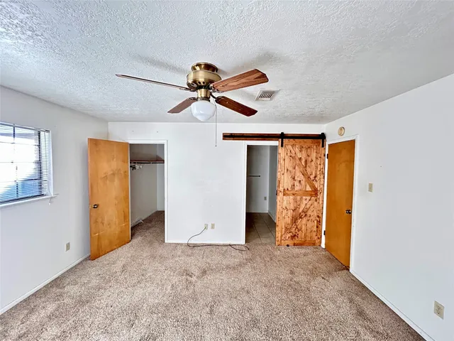 a kitchen with stainless steel appliances granite countertop a refrigerator and a stove