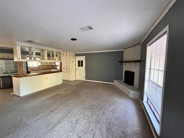 a kitchen with a stove and a microwave