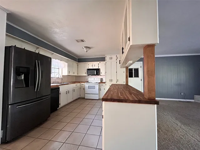 a view of room with a ceiling fan and window