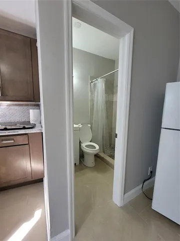 a view of a room with closet and wooden floor