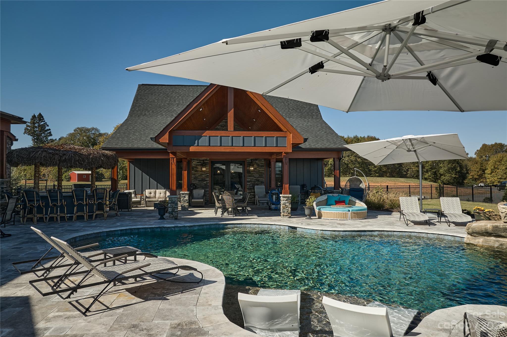 1416 Barbee Road Shelby, NC 28150 - Photo 33 of 41 a patio with a table and chairs under an umbrella