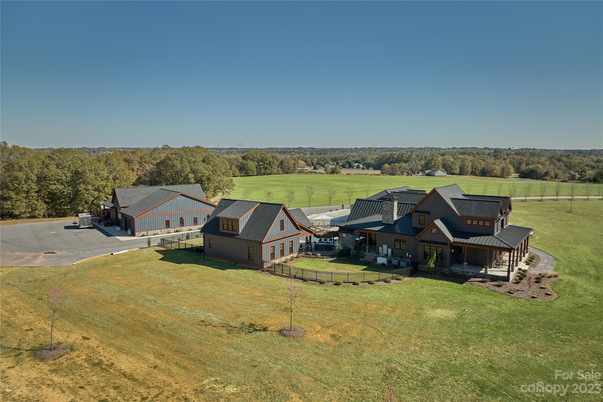 1416 Barbee Road Shelby, NC 28150 - Photo 35 of 41 a view of a house with lawn chairs and a table