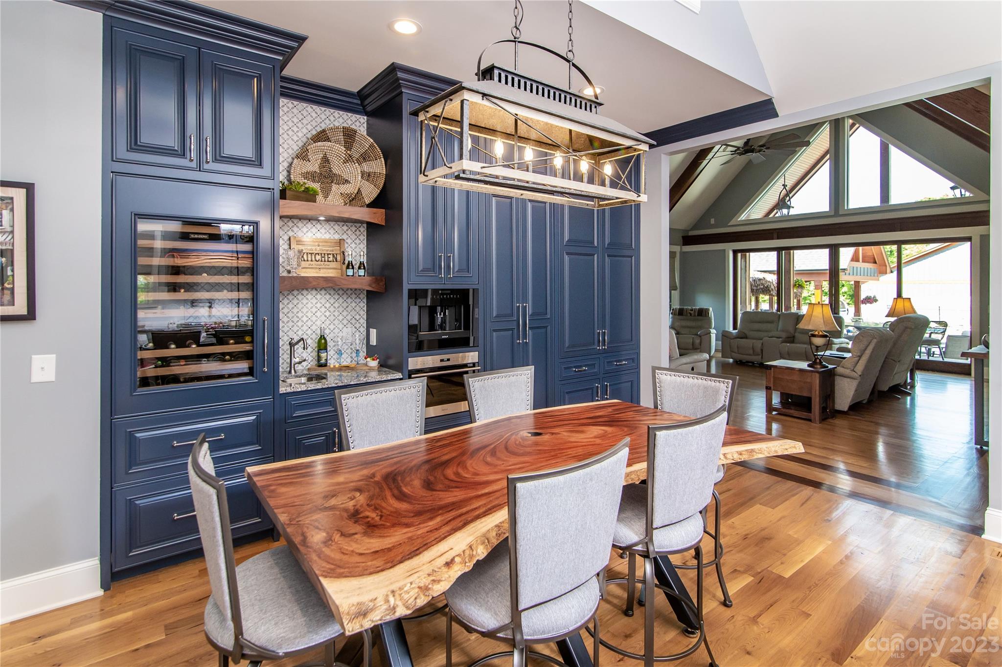 1416 Barbee Road Shelby, NC 28150 - Photo 6 of 41 a dining room with furniture a kitchen view and a fireplace