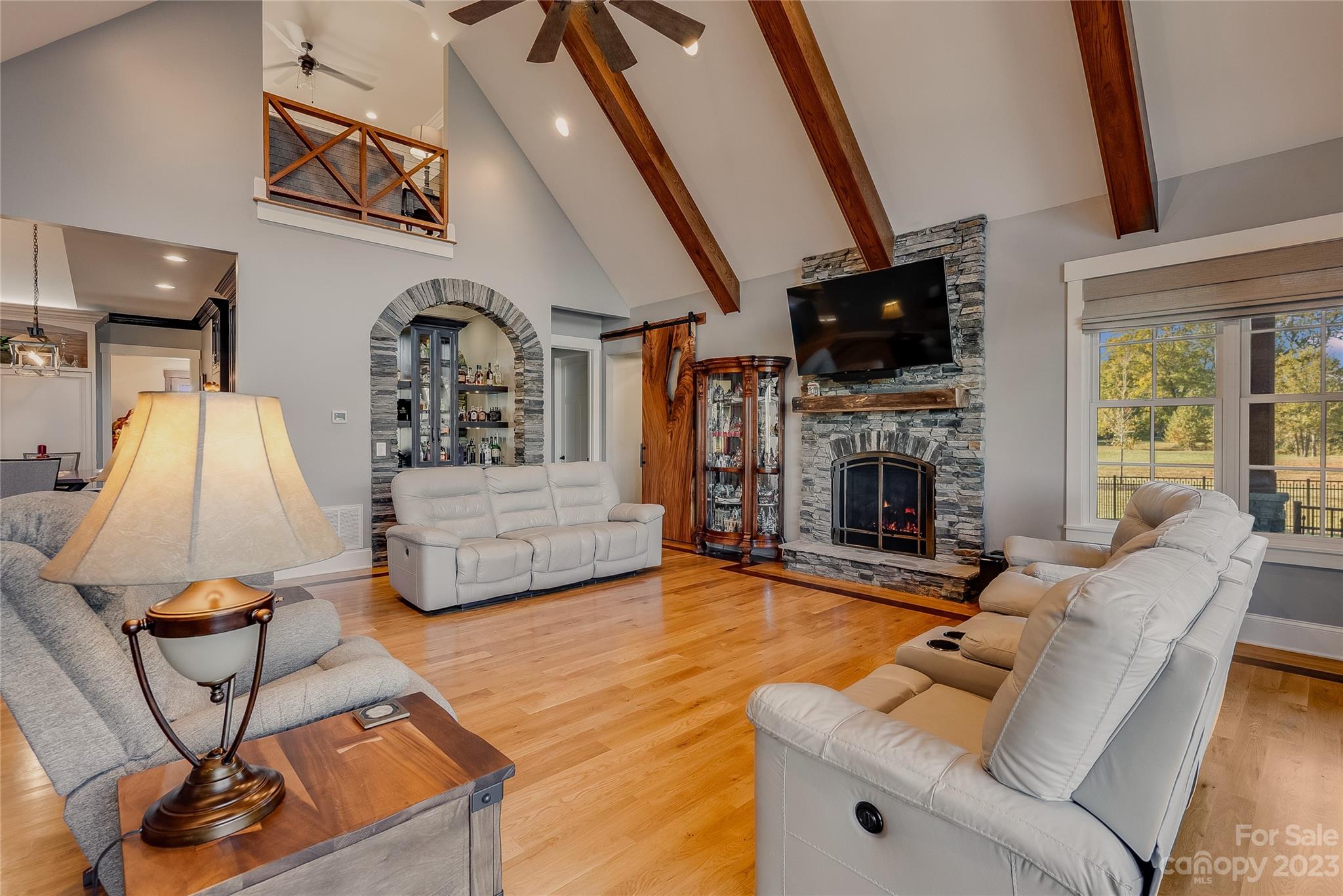 1416 Barbee Road Shelby, NC 28150 - Photo 7 of 41 a living room with furniture a flat screen tv and a fireplace