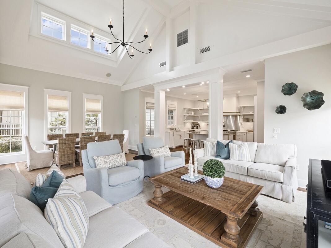 148 Coopersmith Lane Inlet Beach, FL 32461 - Photo 35 of 82 a living room with furniture a table and a chandelier