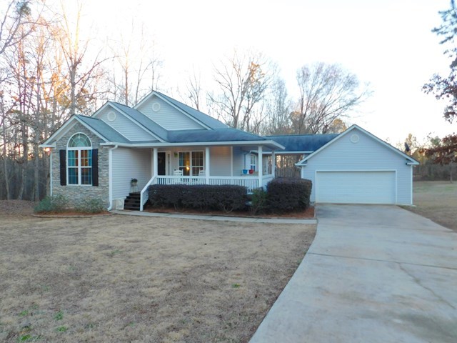 105 Benton Road Juliette, GA 31046 - Photo 1 of 19 a front view of a house with yard
