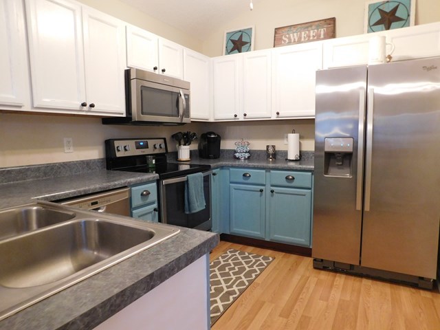 105 Benton Road Juliette, GA 31046 - Photo 3 of 19 a kitchen with stainless steel appliances granite countertop a refrigerator sink and microwave