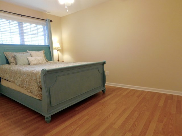 105 Benton Road Juliette, GA 31046 - Photo 10 of 19 a bed sitting in a bedroom next to a window