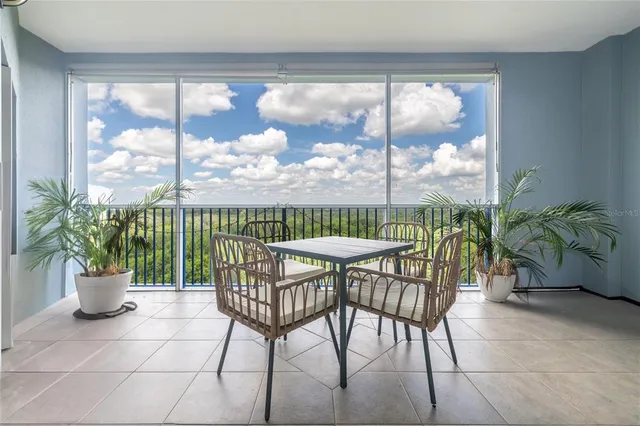 a view of room with wooden floor and windows