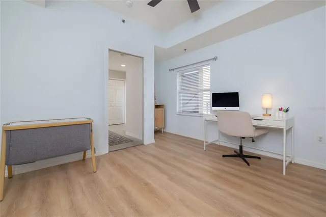 a kitchen with granite countertop a sink a stove and cabinets